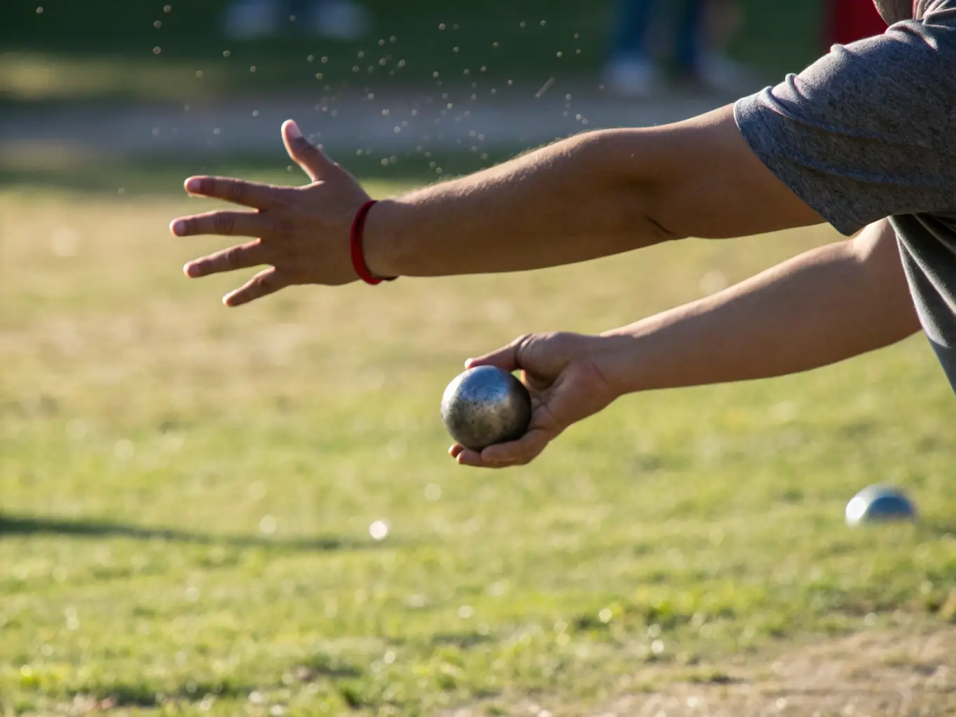 A close-up image of pétanque balls being thrown during a tournament, highlighting the precision and skill involved in the sport.